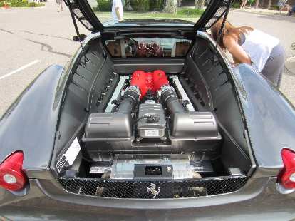 Kelly checks out the interior of the Ferrari 360 Modena while I check out the V8 engine and Testarossa intake covers. 