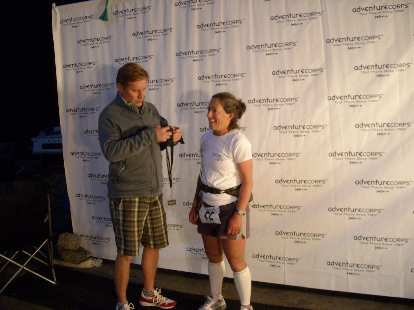 Badwater race director Chris Kostman presenting a finisher's medal to Alene.