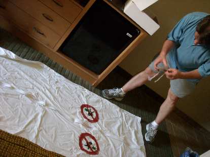 Nathan with a body bag ("just in case") with "no puke zone" logos.