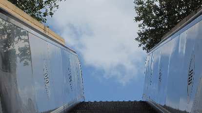 Clouds above the top of an escalator. Clouds above the top of an escalator.