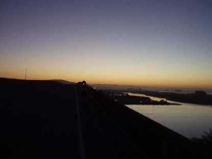 [Mile 7, 5:43 a.m.] As the sun took a peak over the horizon, I followed AJ across the shoulderless Petaluma Bridge on CA-37.  This would be just one of the several highways we'd have to ride on.