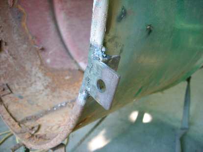 I welded and grinded some tabs for bolting a steel frame section (that I also had to weld up) to the front of the machine.