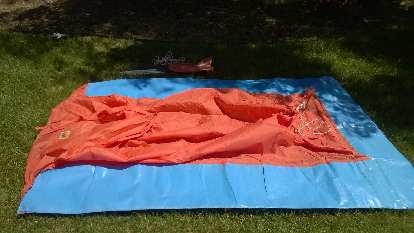 The previous owner of my house left this blue and orange plastic 2-person tent. I gave it away on Craigslist. blue and orange plastic 2-person tent
