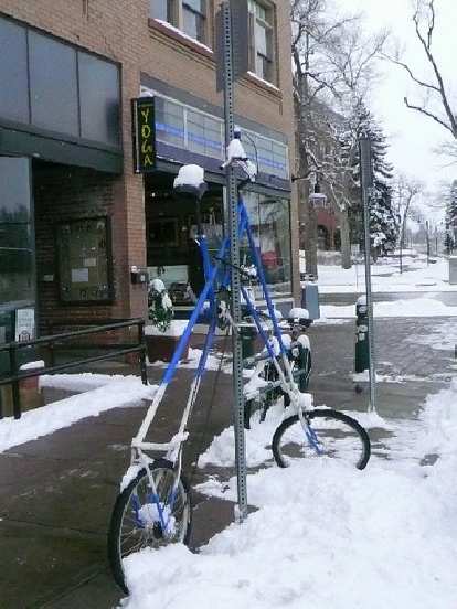 Not a bike rack per se, but what the owner of this tall bike locked it up to on a December day outside Bikram Yoga.