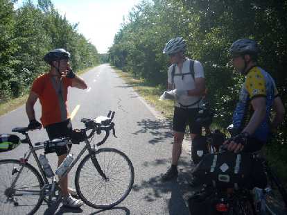 [Mile 361] We encoutered Anthony (on the left) who was on his way back to the Boston.  Moments before this, he flew over his handlebars into a tree and some grass, cracking his helmet but sustaining no injuries.