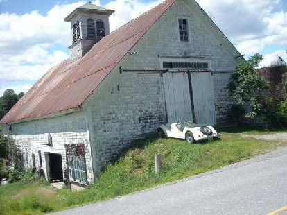 [Mile ~126] A Morgan in front of an old barn in Vermont.