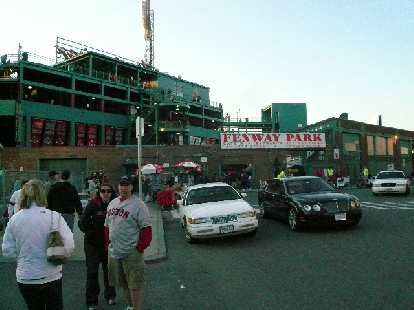 Fenway Park with a Bentley idling in front.