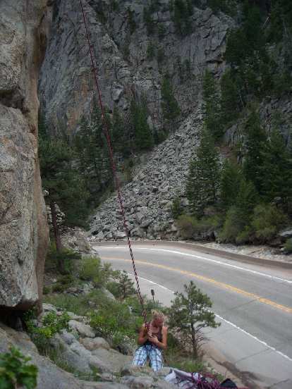 Anita reaching the bottom after rappelling off Qs. Anita reaching the bottom after rappelling off Qs.