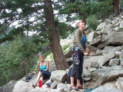 Anita on belay with Isabel looking on.