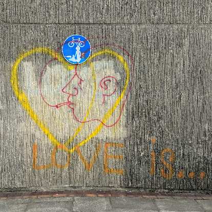 "Love is..." graffiti near the coast in Brighton and Cove. "Love is..." graffiti near the coast in Brighton and Cove.