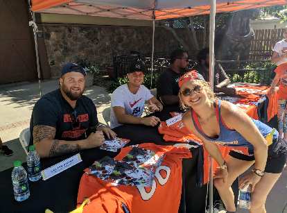 Broncos Dalton Risner and River Cracraft with Emily.