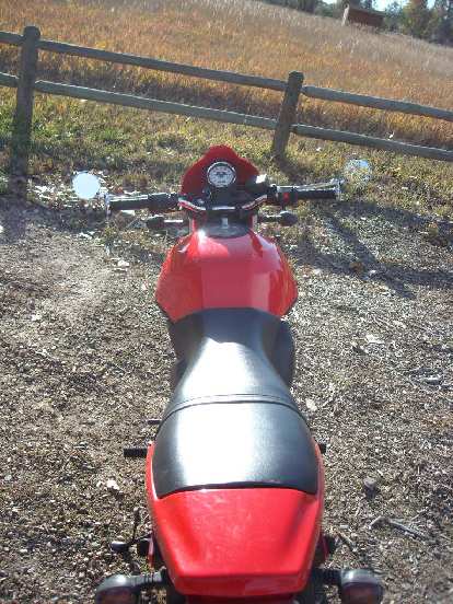 Rear view of the Buell Blast with Bikemaster Superbike handlebars and bar-end mirrors.