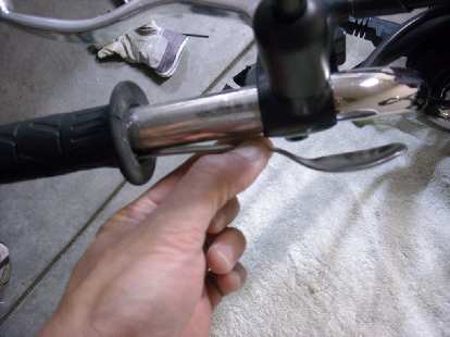I used a spoon handle and then a flat screw driver to unstick the left grip from the handlebars. I used a spoon handle and then a flat screw driver to unstick the left grip from the handlebars.