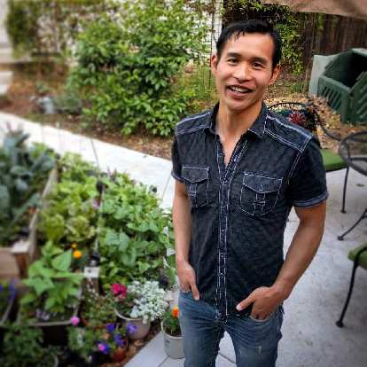 Felix Wong in front of the garden at Stan's casita in Sacramento.