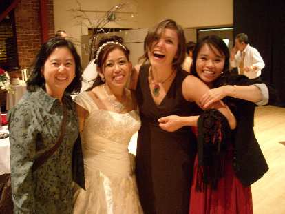Esther, Trang, Leah, and Nga at Trang's wedding reception.  Nga really liked Leah's toned arms.