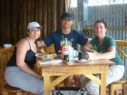 Raquel, Felix Wong and Tori at an outdoor Caribbean restaurant in town after a four-hour hike through the Cahuita National Park.