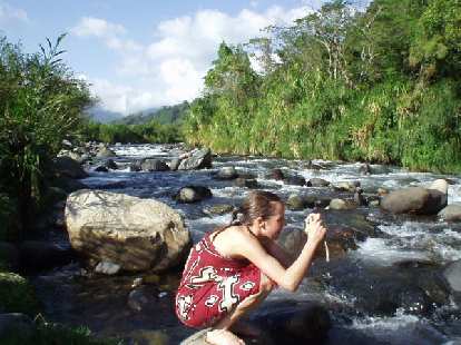 Andrea takes a photo with a splendid upstream view of the Caldera in the background.