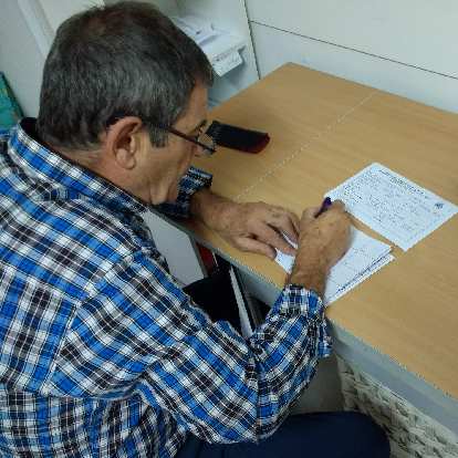 At the Albergue de Peregrinos in Irún, I picked up a pilgrim's passport (credencial in Spanish).  Here is a man running the albergue filling out the passport and giving me my first stamp.