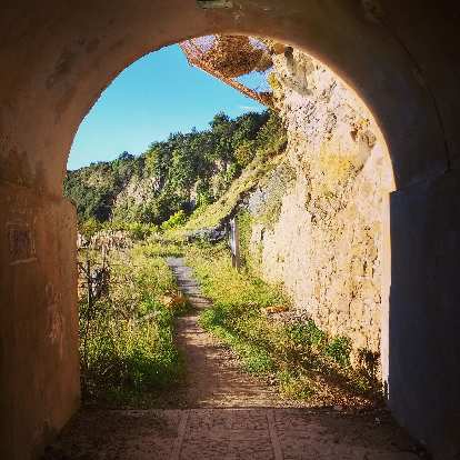 A trail and tunnel near Playa Ostende, Spain.