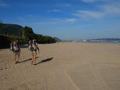 John and Karen from the UK along the beach near Argoños, Spain. They had crewed for the Race Across America (RAAM) last year.