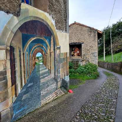A beautiful mural of a path through an arched corridor along the Camino de Santiago del Norte.