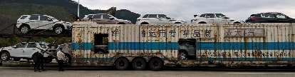 A whole truckload of white Land Rovers near Sanming, China. (18 Apr 2016) A whole truckload of white Land Rovers near Sanming, China.