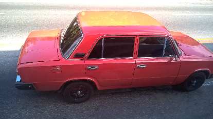 A red/orange Lada sedan with Honda "Type R" logos as seen east of Havana, Cuba. (07 Jan 2017) A red/orange Lada sedan with Honda "Type R" logos as seen east of Havana, Cuba.