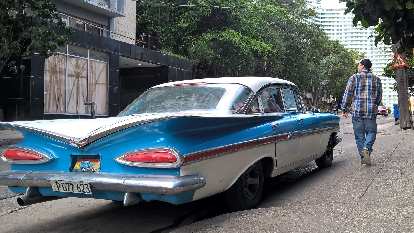 Two-tone aqua/white 1959 Chevrolet Impala four-door sedan in Havana, Cuba. (08 Jan 2017) Two-tone aqua/white 1959 Chevrolet Impala four-door sedan in Havana, Cuba.