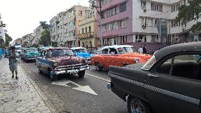 Several almendrones (pre-revolutionary cars as taxis) can be seen here in Havana, Cuba.