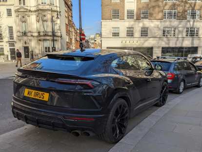A black Lamborghini URUS SUV in London.