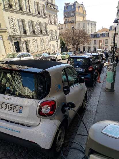 Electric Smart cars being charged in Montmartre.