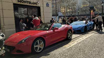 A red Ferrari California and a blue Lamborghini Huracán convertible near the Champs-Élysées were available for rent for about 100 euros for 30 minutes.