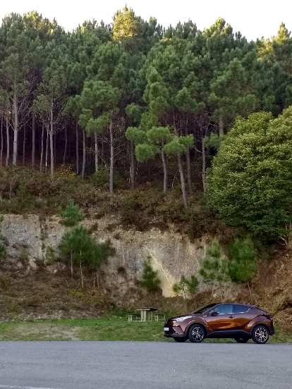 A maroon Toyota CH-R hybrid in Fisterra, Spain. (13 Oct 2017) A maroon Toyota CH-R hybrid in Fisterra, Spain.
