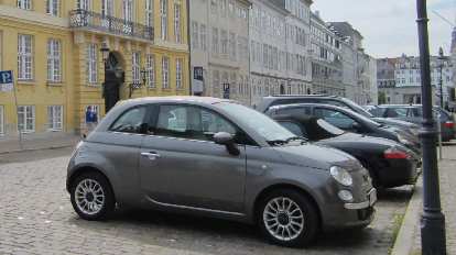 Fiat 500 (and a Porsche Boxster behind it) in Copenhagen. Fiat 500 (and a Porsche Boxster behind it) in Copenhagen.