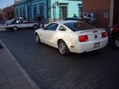 I saw three Ford Mustangs -- one from the 90s, and two from 2008 or so including this white one. I also saw a billboard advertising the new Camaro so Mexico must get that too. I saw three Ford Mustangs -- one from the 90s, and two from 2008 or so including this white one. I also saw a billboard advertising the new Camaro so Mexico must get that too.