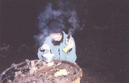 Tending to our angel hair pasta for dinner. If you must know, the pasta on the fire pit outside of the pot was due to Sarah's little "pasta accident"!