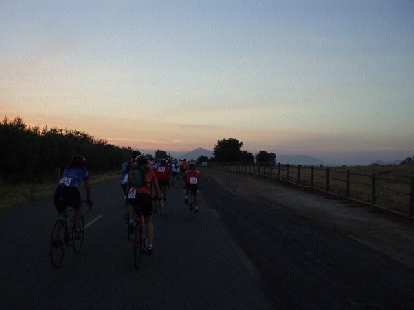 [Mile 10, 6:04 a.m.] During the first 15 miles, which were actually flat, all of us 200 cyclists rode in packs, enjoying a nice sunrise.