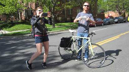Ellen Silva, Terry Grenwelge taking photos at the 2015 Colfax Half Marathon