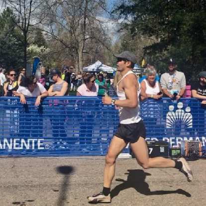 Felix Wong sprinting into the finishing chute of the 2019 Colorado Marathon.