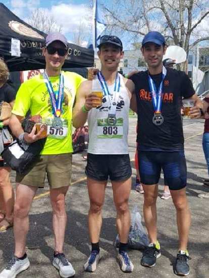 Carl, Felix, and Antxon with celebratory beers from Odell Brewing Company after finishing the 2019 Colorado Marathon.