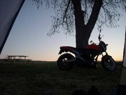 Waking up in the morning to the sight of a nice sunrise and the Buell.