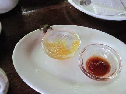 Photo: Lizardo tasting the marmalade at breakfast in Cahuita.