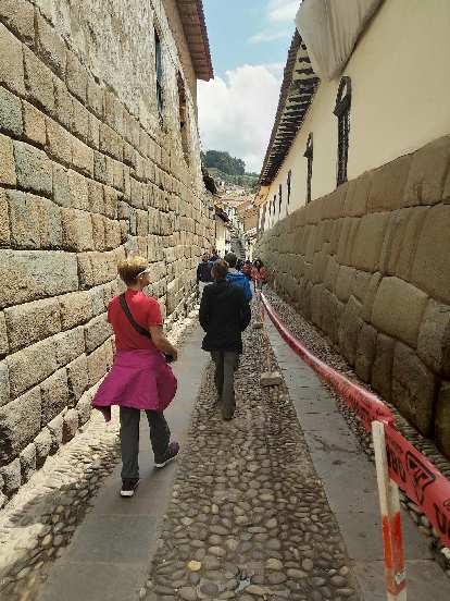 Walking down an alley featuring Inca stonework.