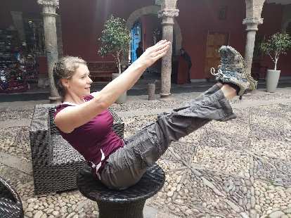 Teresa doing a yoga pose on a table in the terrace of the Hotel Costa del Sol Ramada.