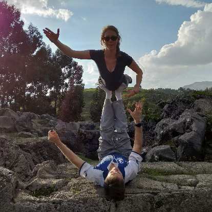 Teresa and Matthew doing an acroyoga pose.