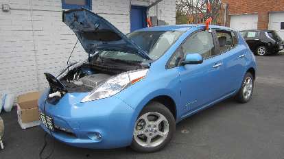 A Nissan Leaf being recharged. A Nissan Leaf being recharged.