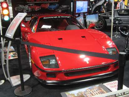 A red Ferrari F40 at the Man Cave detailing company booth. red Ferrari F40, Man Cave Colorado, 2015 Denver Auto Show