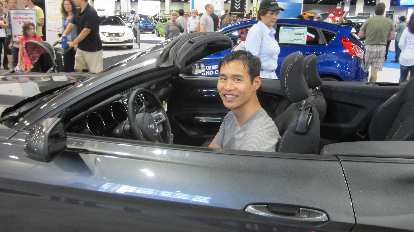 Felix Wong in a grey 2015 Ford Mustang convertible. Felix Wong, grey 2015 Ford Mustang convertible