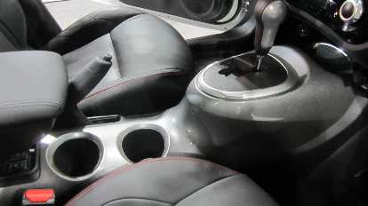 The center console of the Nissan Juke was inspired by a motorcycle gas tank. motorcycle gas tank inspired grey center console, Nissan Juke