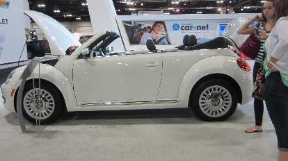 white Volkswagen Beetle convertible